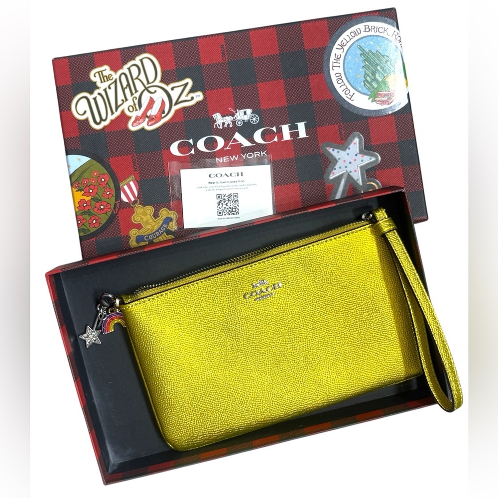 Coach x Wizard of Oz - golden wristlet with charms